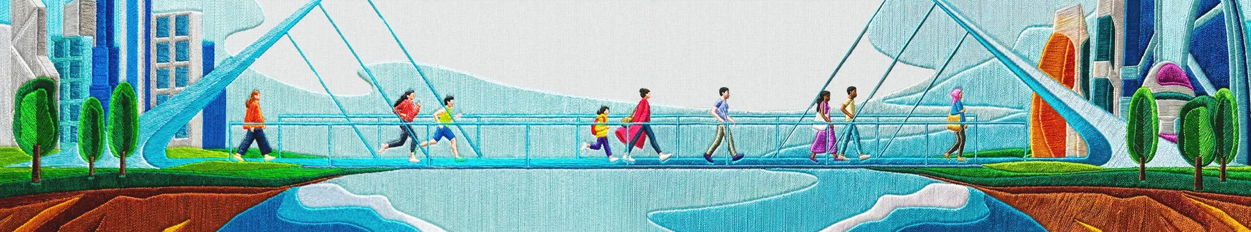 People crossing a bridge together between two sides of a city